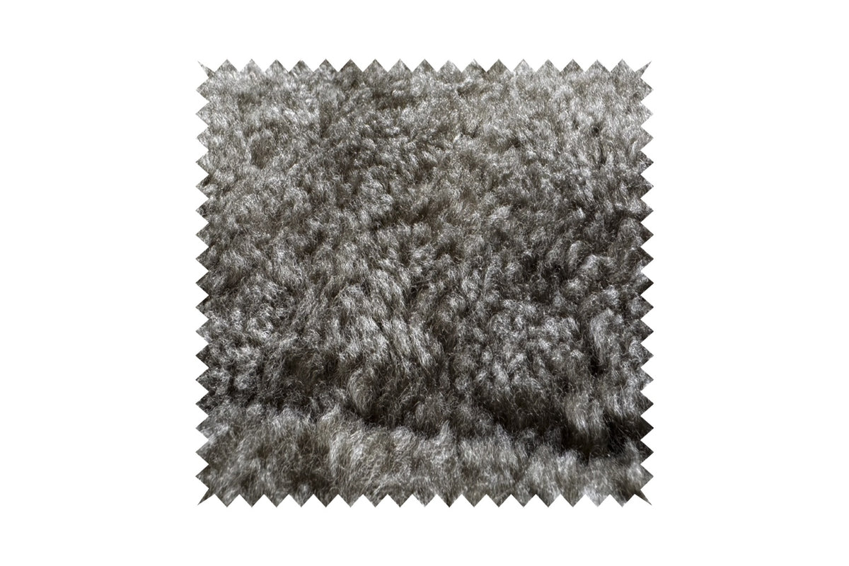 KAWOLA Relaxsessel SILVA Drehsessel Schaffell hellgrau mit Hocker