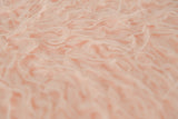 KAWOLA Hocker Fell FYNN Flokati Fellhocker rosa