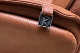 KAWOLA Relaxsessel JOSIANE Drehsessel Lederfaserstoff cognac mit Hocker