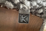 KAWOLA Relaxsessel SILVA Drehsessel Schaffell hellgrau mit Hocker