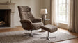 KAWOLA Sessel TOSAR Relaxsessel drehbar Schaffell grau mit Hocker